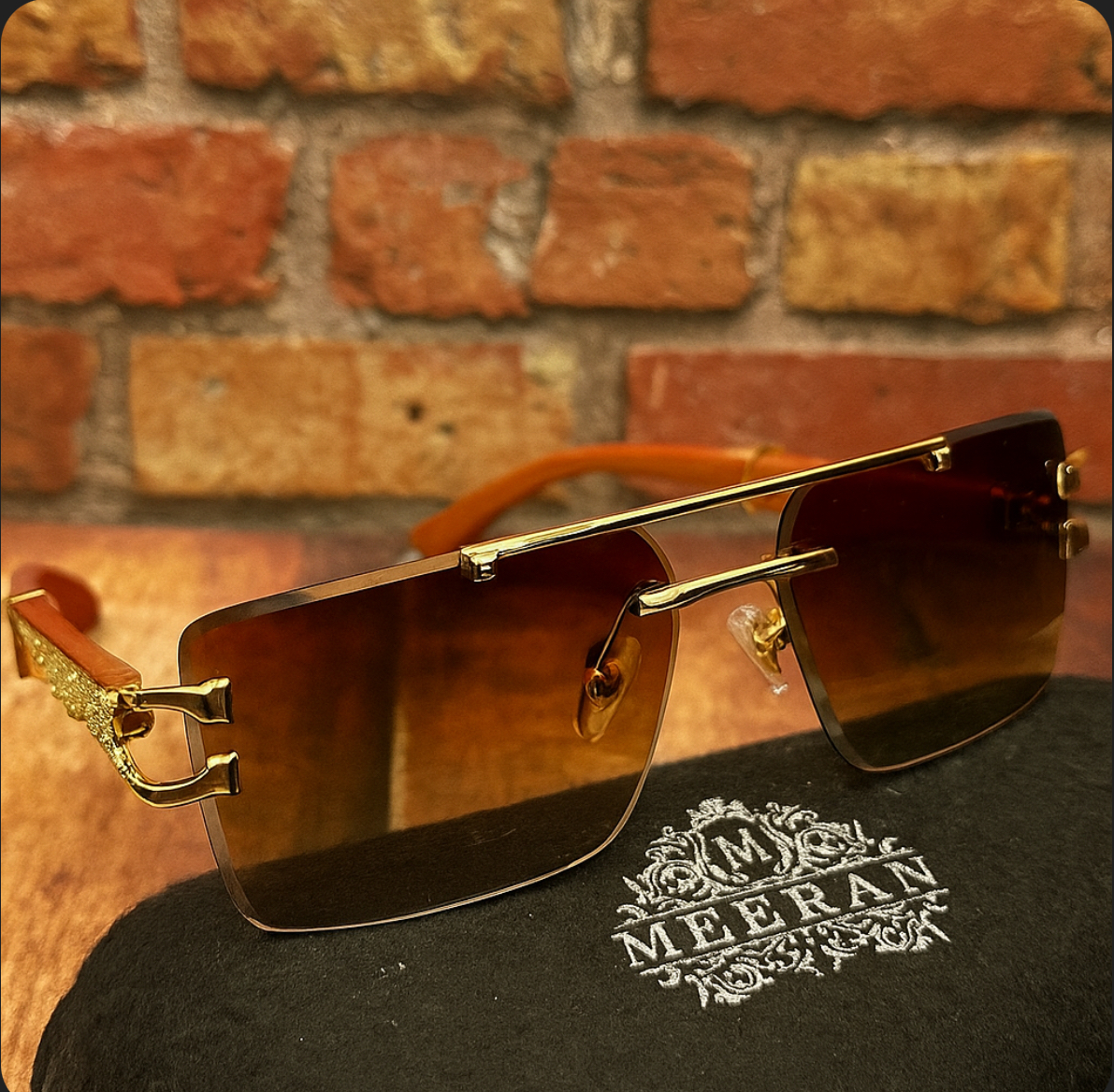 Meeran Jaguar sunglasses with golden gradient lenses and a golden rim, featuring UV protection.