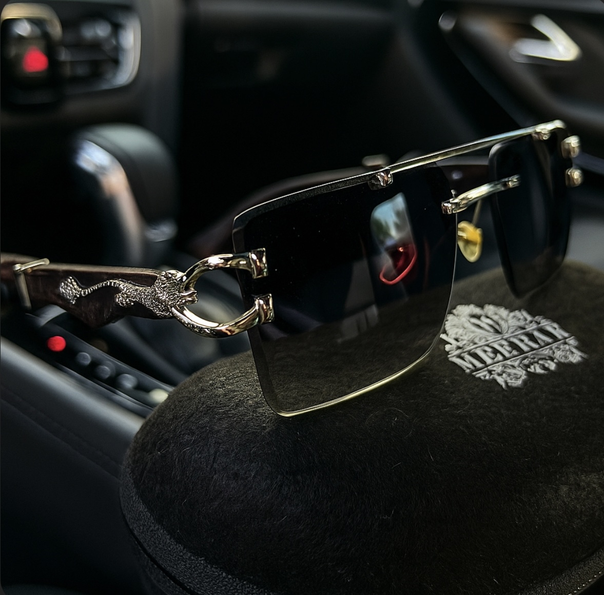 Meeran Jaguar sunglasses with gradient black lenses and a black/silver frame, featuring UV protection