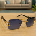 Meeran Jaguar sunglasses with blue lenses and a black/gold frame, featuring UV protection